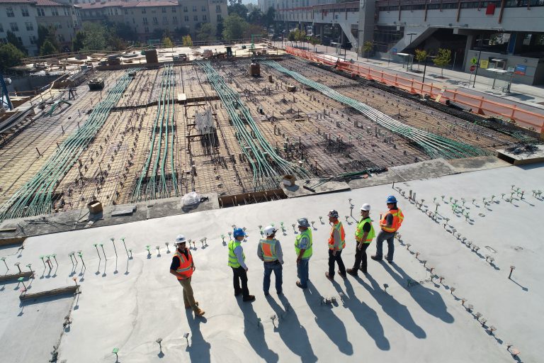 Engineers Standing Over Worksite